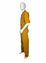 Load image into Gallery viewer, Mannequin wearing a mustard yellow jumpsuit on a white background
