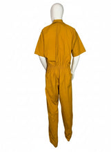 Load image into Gallery viewer, Mannequin wearing a mustard yellow jumpsuit on a white background
