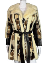 Load image into Gallery viewer, Patterned fur coat with black belt on a mannequin against a gray background
