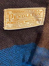 Load image into Gallery viewer, Pendleton label on a textured fabric background
