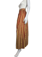 Load image into Gallery viewer, Mannequin wearing a patterned skirt with a plain background
