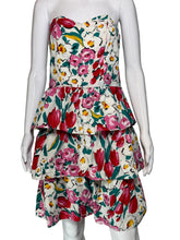 Load image into Gallery viewer, Floral tiered dress on a mannequin against a plain background
