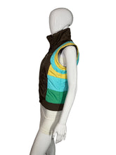 Load image into Gallery viewer, Mannequin wearing a colorful puffy vest on a plain background
