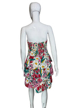 Load image into Gallery viewer, Floral dress on a mannequin against a white wall
