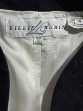 Load image into Gallery viewer, Close-up of a white garment with 'Lillie Rubin' label on a black background
