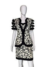 Load image into Gallery viewer, Mannequin wearing a black and white patterned dress against a plain background
