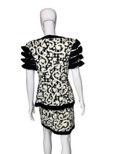 Load image into Gallery viewer, Black and white patterned dress on a mannequin against a plain background
