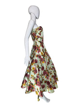 Load image into Gallery viewer, Mannequin wearing a floral dress against a plain wall.
