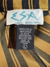 Load image into Gallery viewer, Close-up of fabric with a label on a striped background
