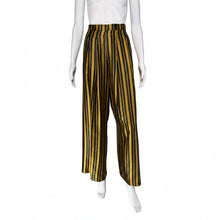 Load image into Gallery viewer, Black and yellow striped pants on mannequins with a neutral background
