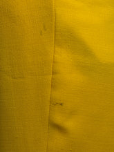 Load image into Gallery viewer, Close-up of yellow fabric a small hole and a stain
