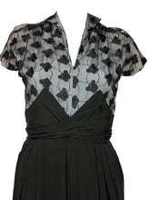 Load image into Gallery viewer, Black dress with butterfly pattern on a mannequin
