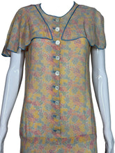 Load image into Gallery viewer, Floral dress on a mannequin against a plain background
