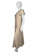 Load image into Gallery viewer, Floral dress on a mannequin against a plain background
