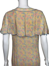 Load image into Gallery viewer, Floral-patterned dress on a mannequin against a neutral background
