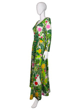 Load image into Gallery viewer, Green floral Jumpsuit on a mannequin against a white wall
