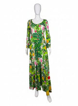 Load image into Gallery viewer, Green floral Jumpsuit on a mannequin against a white wall

