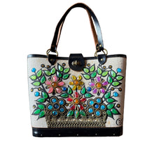 Load image into Gallery viewer, Hand-painted floral design on a handbag against a gray background
