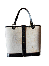 Load image into Gallery viewer, Handbag with black leather straps on a gray background

