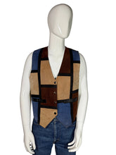 Load image into Gallery viewer, Mannequin wearing a patchwork vest with brown, blue, and beige colors on a plain background.
