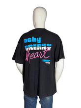 Load image into Gallery viewer, Black t-shirt with colorful text on a mannequin against a plain background
