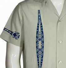 Load image into Gallery viewer, Light gray shirt with blue tribal design on a mannequin

