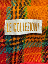 Load image into Gallery viewer, Label tag on a colorful fabric background
