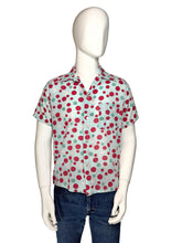 Load image into Gallery viewer, Mannequin wearing a colorful polka dot smiley face shirt with a plain background
