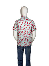 Load image into Gallery viewer, Mannequin wearing a colorful polka dot smiley face shirt with a plain background
