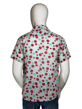 Load image into Gallery viewer, Mannequin wearing a colorful polka dot smiley face shirt with a plain background
