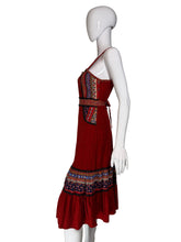 Load image into Gallery viewer, Red dress with patterned layers on a white mannequin against a plain background
