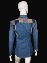 Load image into Gallery viewer, Blue denim jacket with patchwork shoulders on a mannequi
