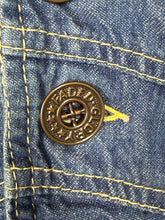 Load image into Gallery viewer, Close-up of a bronze button on denim fabric with 'Faded Glory' branding.
