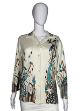 Load image into Gallery viewer, Mannequin wearing a patterned shirt with long sleeves on a plain background
