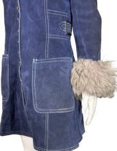 Load image into Gallery viewer, Blue jacket with gray fur trim on a mannequin against a white wall.
