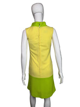 Load image into Gallery viewer, Mannequin wearing a bright yellow dress with a green top against a plain background
