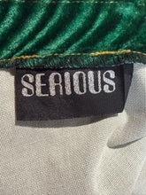 Load image into Gallery viewer, Close-up of a label with 'SERIOUS' text on fabric.

