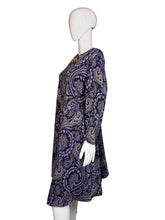 Load image into Gallery viewer, Mannequin wearing a purple paisley patterned dress
