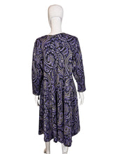 Load image into Gallery viewer, Mannequin wearing a purple paisley patterned dress
