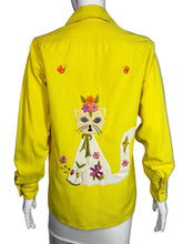 Load image into Gallery viewer, Yellow shirt with floral embroidery on a mannequin 
