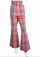 Load image into Gallery viewer, Red and blue plaid pants on a mannequin against a wall.
