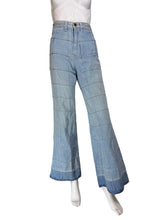 Load image into Gallery viewer, Light blue wide-leg denim jeans displayed on a white mannequin
