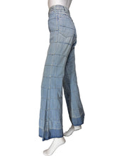 Load image into Gallery viewer, Light blue wide-leg denim jeans with a large windowpane plaid pattern, displayed on a white mannequin.
