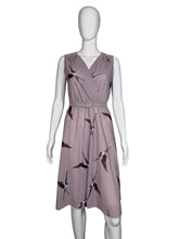 Load image into Gallery viewer, Lavender dress with a bird print on a mannequin against a plain background

