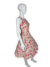 Load image into Gallery viewer, Mannequin wearing a floral dress against a white wall.
