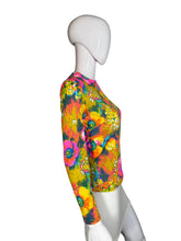 Load image into Gallery viewer, Colorful floral-patterned top on a mannequin against a neutral background
