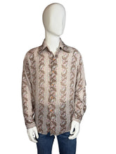 Load image into Gallery viewer, Mannequin wearing a patterned shirt with a plain background
