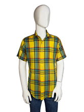 Load image into Gallery viewer, Mannequin wearing a yellow plaid shirt and blue jeans on a plain background
