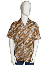 Load image into Gallery viewer, Mannequin wearing a patterned shirt on a plain background
