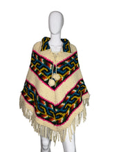 Load image into Gallery viewer, Colorful knitted poncho with patterns on a mannequin against a white background
